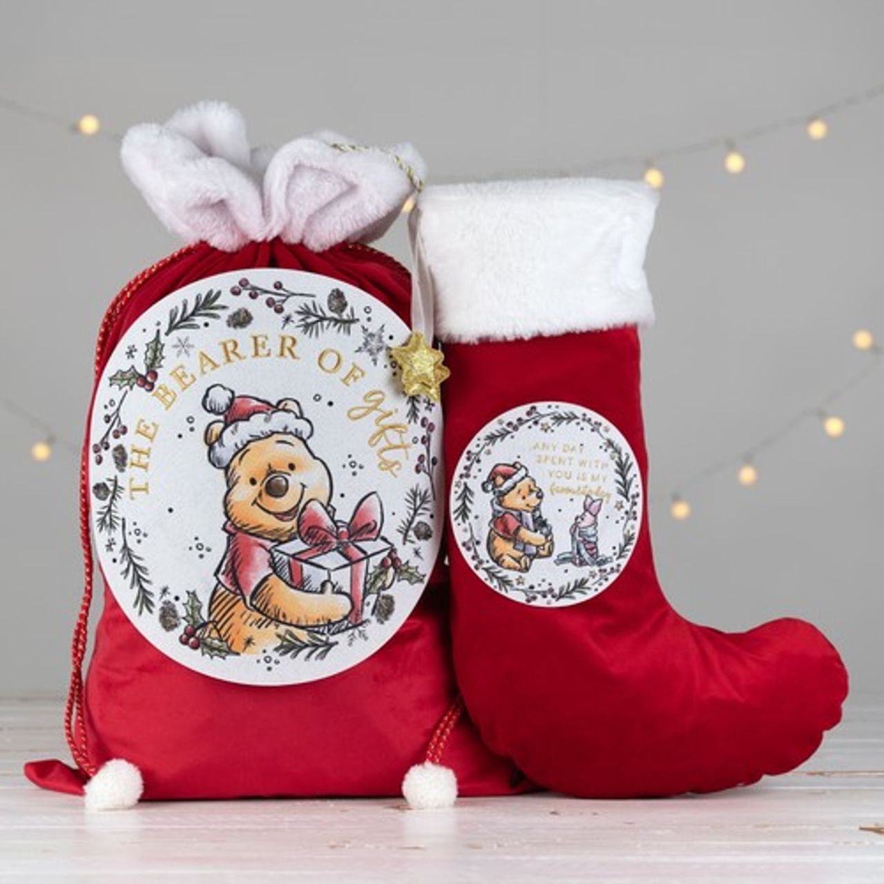 Disney Winnie Christmas Stocking "Favourite Day"  Fill this Winnie the Pooh stocking with gifts to brighten any little one's Christmas morning. With a sentimental quote featuring in sparkling gold letters above a delightful illustration of Winnie the Pooh and Piglet, this sack is as adorable as it is unique.