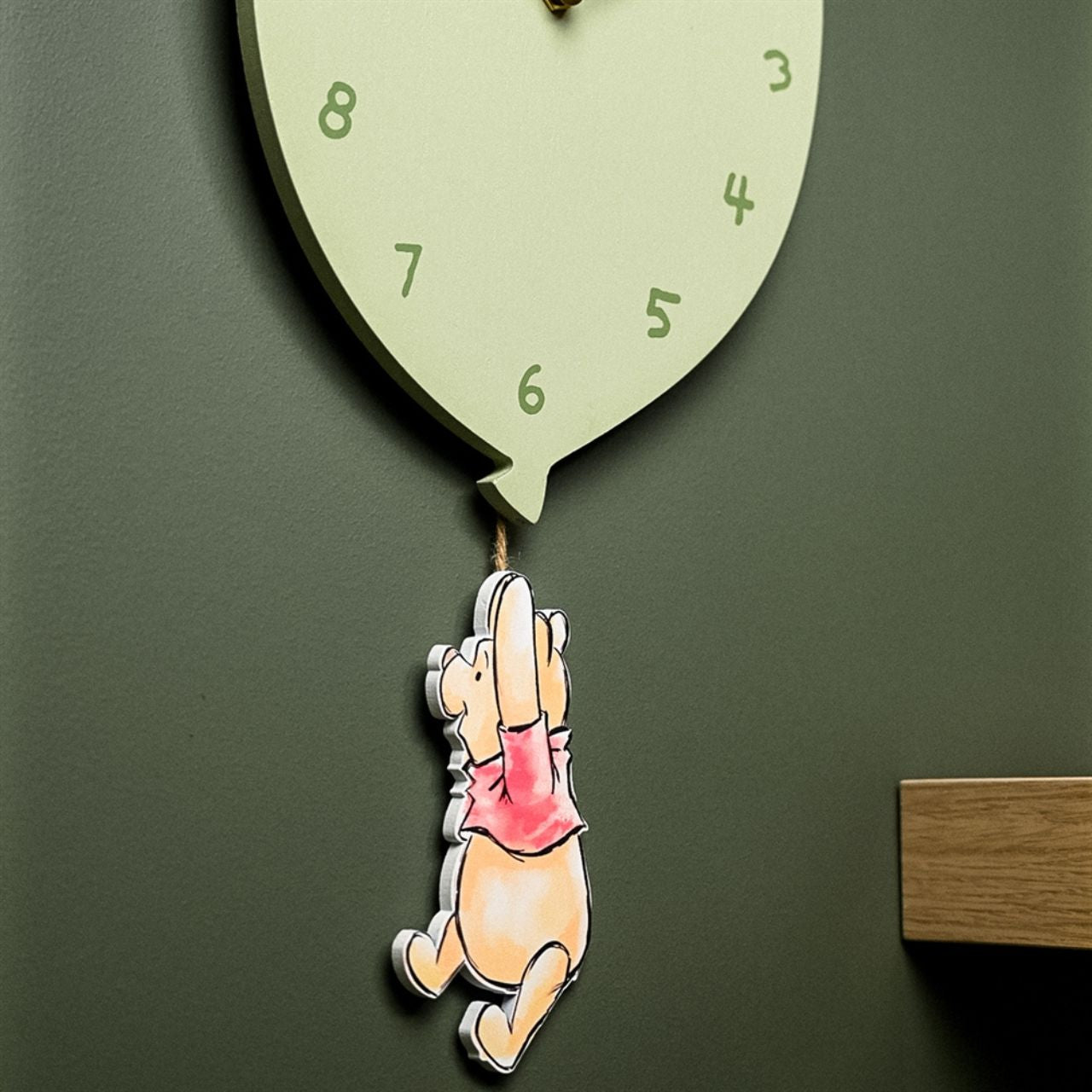 Add a touch of whimsy to your walls with this delightful Disney Winnie The Pooh Balloon Wall Clock from DISNEY.
