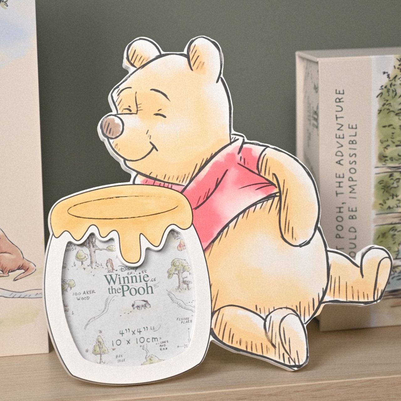 Capture precious memories with this delightful Disney Winnie The Pooh Shaped Photo Frame from DISNEY.
