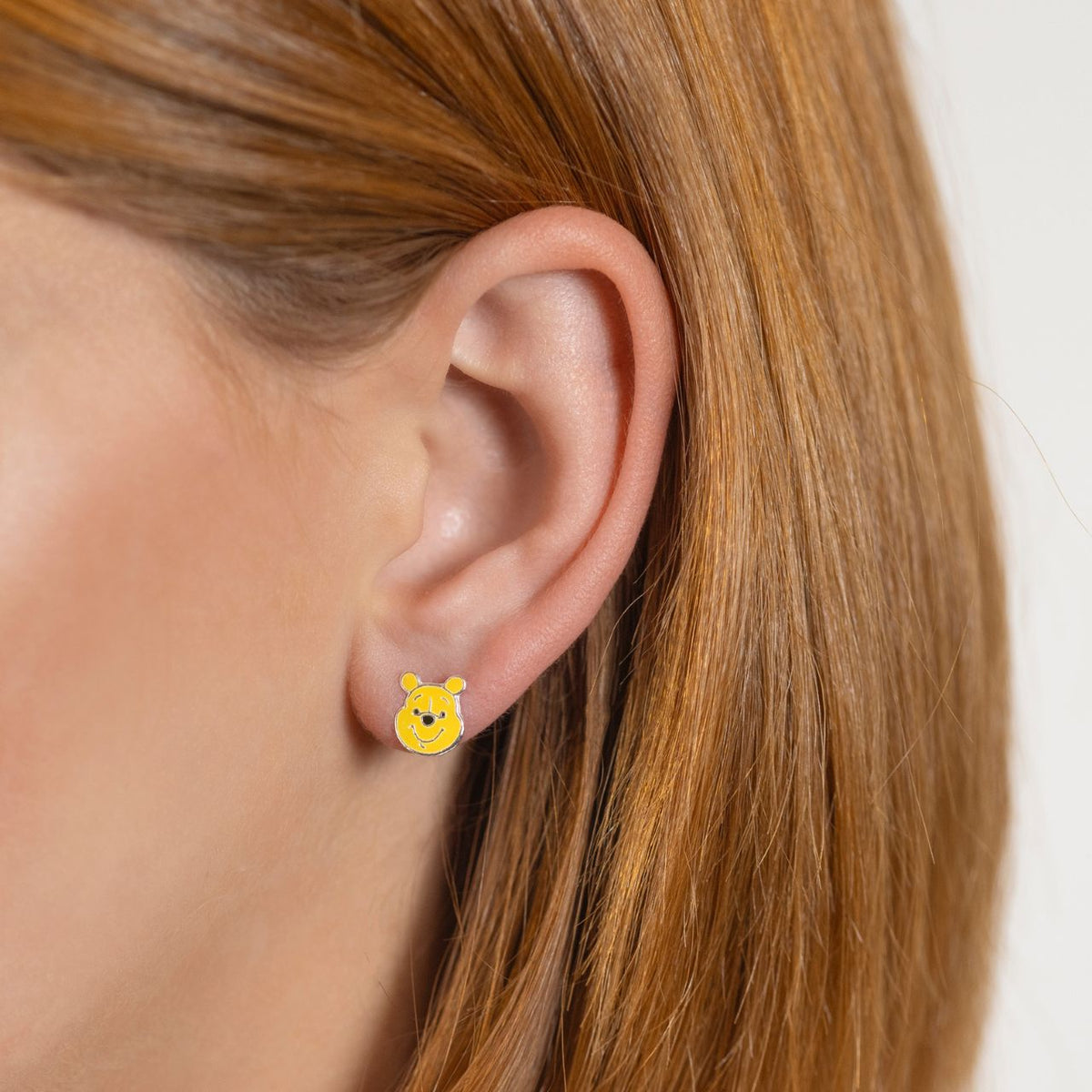 Delight young Disney fans with these charming Winnie the Pooh Sterling Silver Earrings. Crafted from quality sterling silver, these stud earrings feature the beloved honey-loving bear character, making them a perfect gift for children who adore the Hundred Acre Wood adventures.