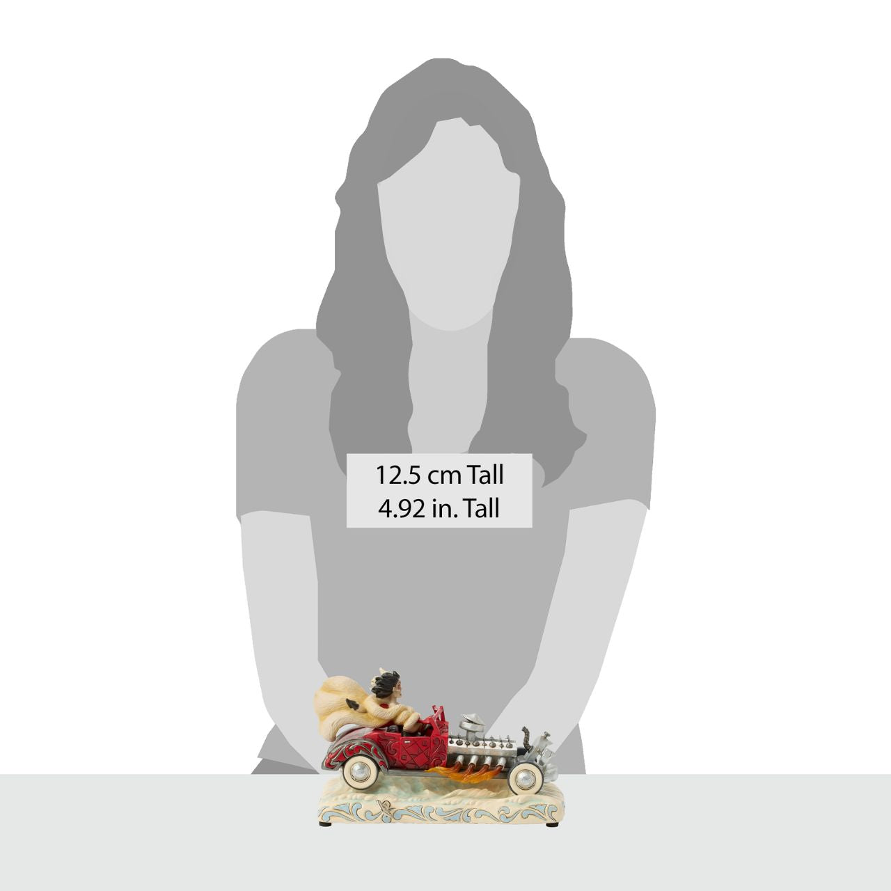 Celebrating the 65th anniversary of 101 Dalmatians, Jim Shore captures Cruella de Vil speeding in her red car adorned with rosemaling and patchwork. Flames burst from the engine as her wild hair and fur coat fly in tune to her signature melody, which is played by a wind-up key.