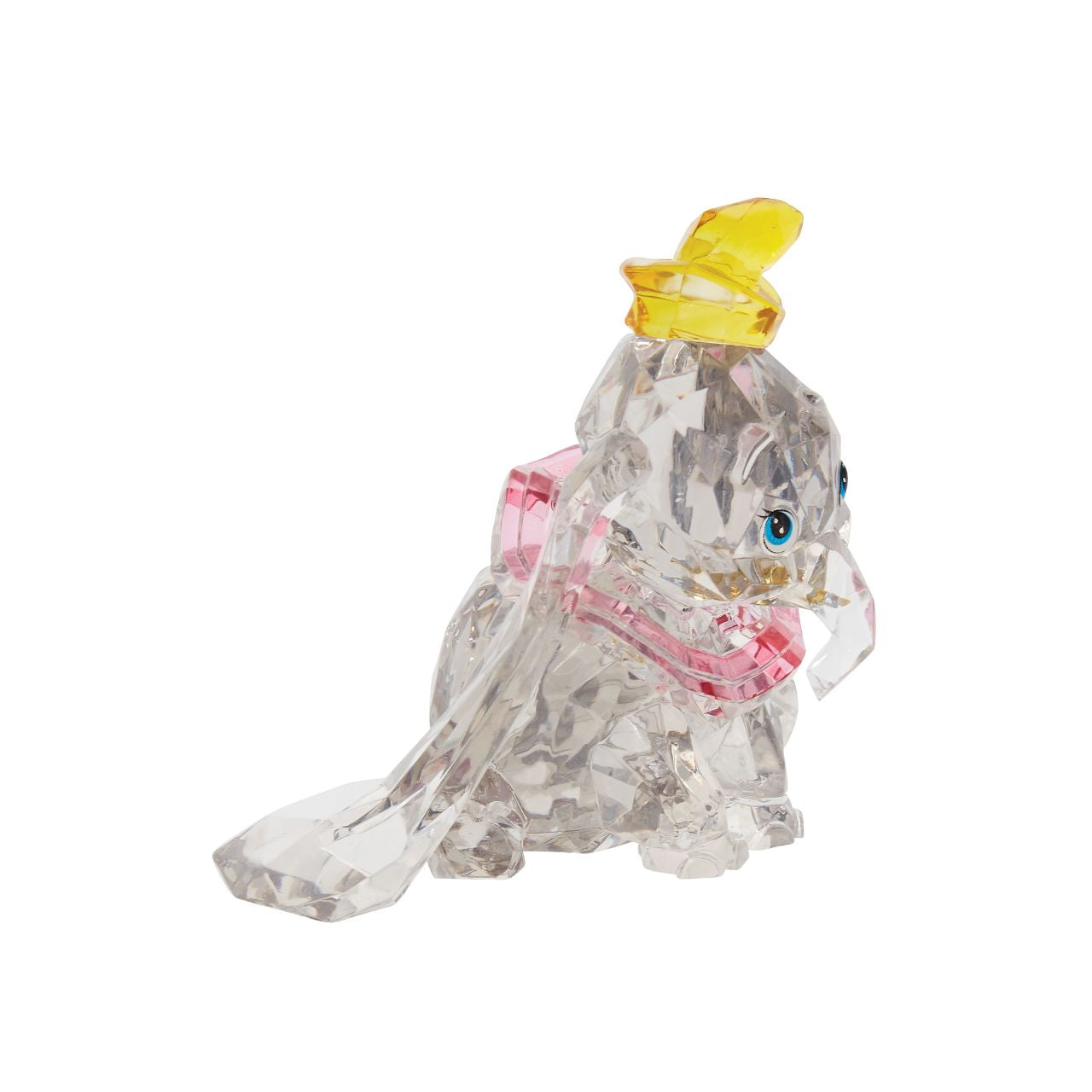 This "gem cut" acrylic sculpture reflects the ninth wonder of the universe. The world's only flying elephant. Dumbo is already for his circus debut with his yellow hat and pink collar. Presented in a branded window gift box. Not a toy or children's product. Intended for adults only.