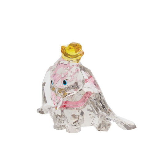 This "gem cut" acrylic sculpture reflects the ninth wonder of the universe. The world's only flying elephant. Dumbo is already for his circus debut with his yellow hat and pink collar. Presented in a branded window gift box. Not a toy or children's product. Intended for adults only.