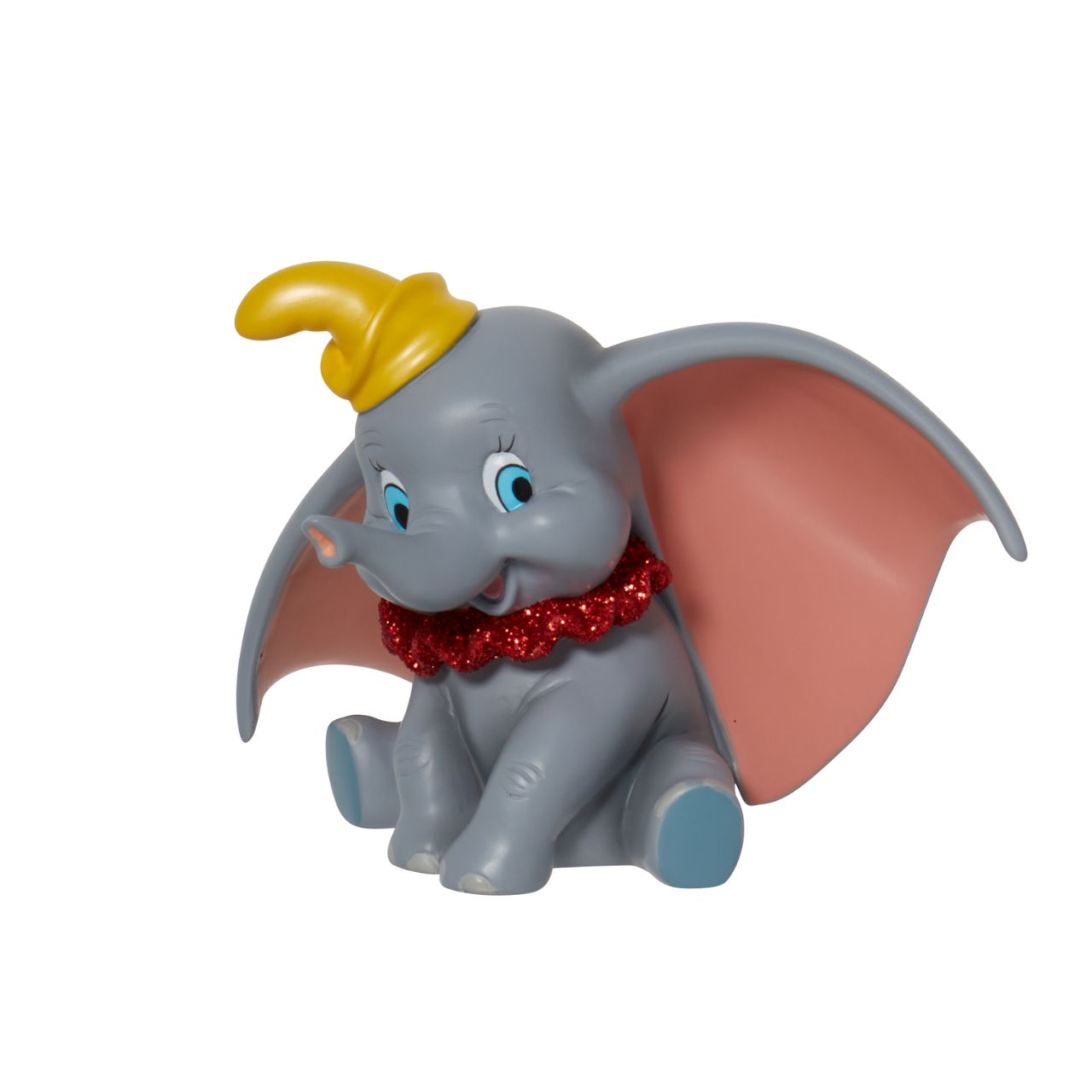 Everyone's favourite flying elephant looks circus-ready in this adorable pose by Disney Showcase. This realistic figurine has a beautiful finish complete with red glitter. This is a great addition to any nursery and is not a toy or children's product.