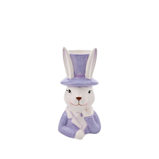 Bring a playful touch to your product line with the Eggs-traordinary Gifting Company's Bunny in Top Hat Purple Planter. Featuring an adorable bunny in pastel purple, this charming planter adds a whimsical flair on its own and even more vibrancy when paired with plants or flowers.