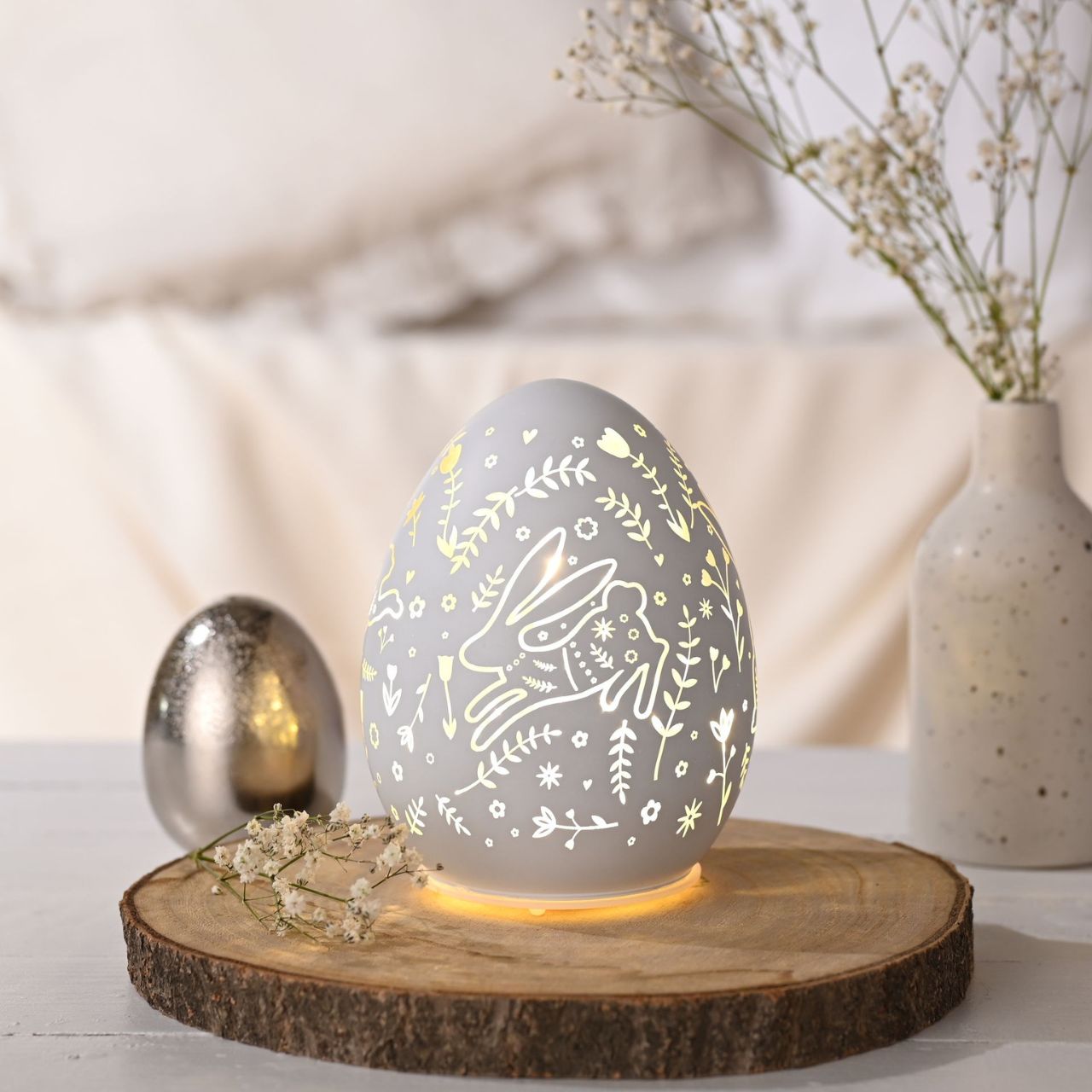 Add a touch of Easter charm to your décor with this LED battery-operated light. Shaped like an egg and adorned with a playful bunny design, this light illuminates to project a delightful springtime pattern