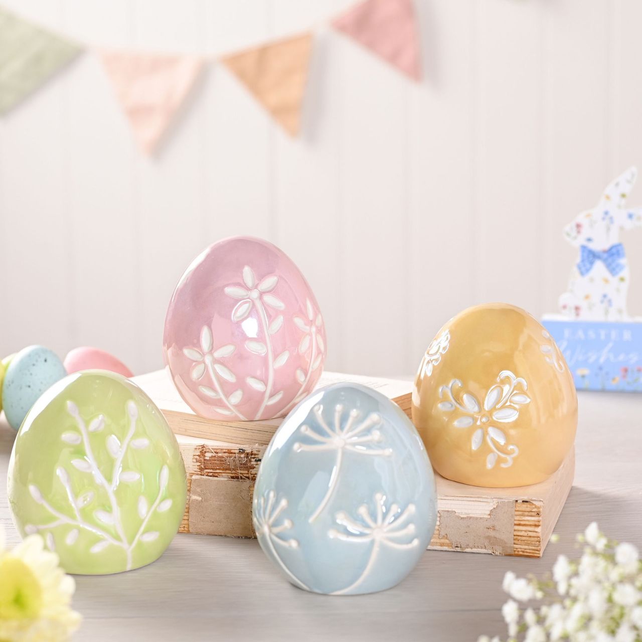 These pastel-coloured eggs is a charming addition to any collection. Crafted in soft pink, blue, orange, and green with a glossy finish and unique patterns, these eggs beautifully blend traditional and contemporary styles.