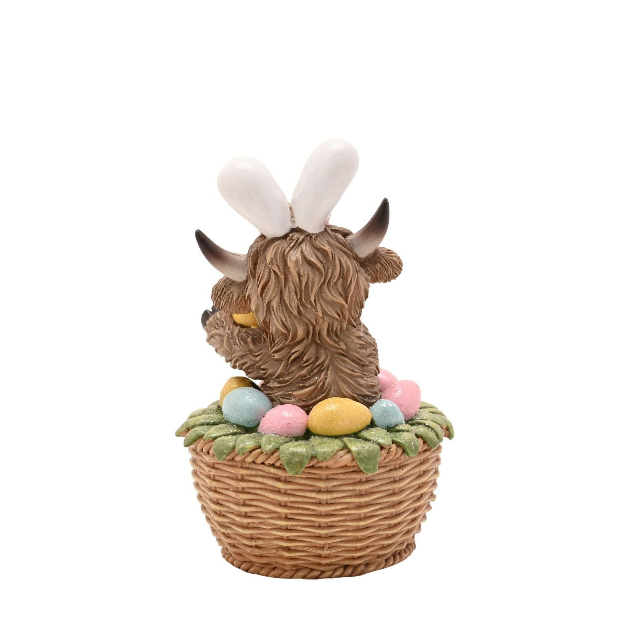 A seasonal update on a popular design, The Eggs-traordinary Gifting Co. Highland Cow in an Easter Basket figurine features the character with bunny ears.