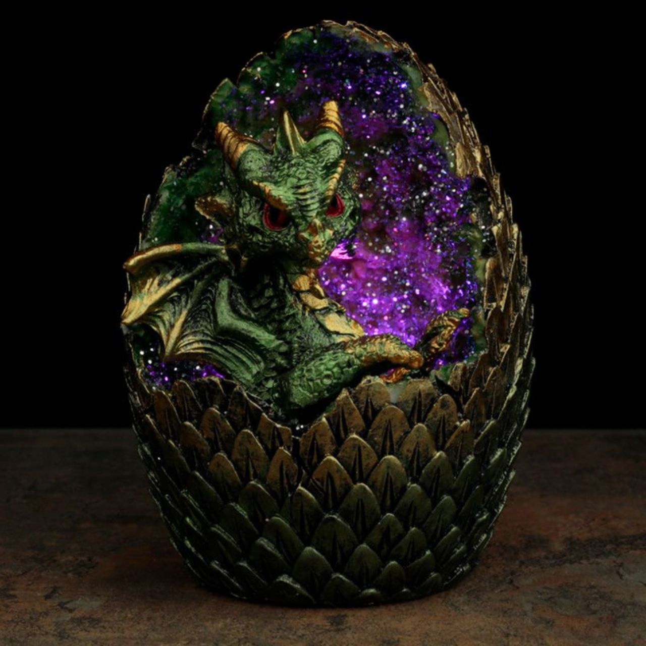 Elements Baby Dragon LED Crystal Egg  - Material: Resin and Plastic - Batteries Required: 2 x LR44 - Batteries Included: Yes - LED: Controlled by an on/off switch on the bottom, the LED rotates between multiple colours.
