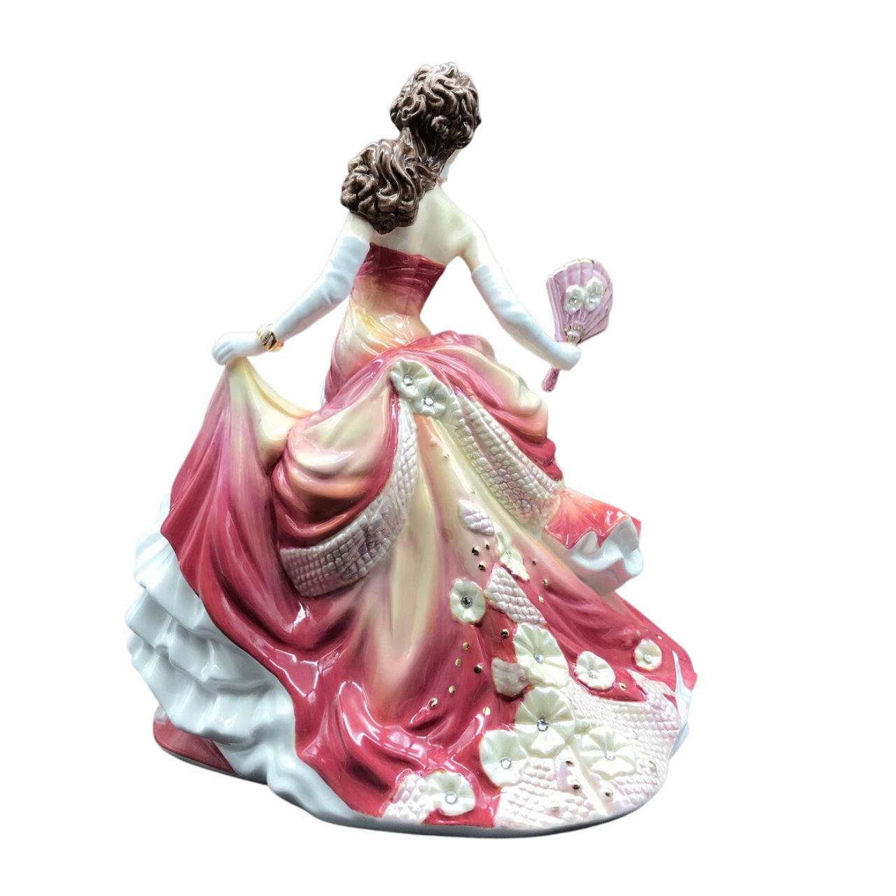 English Ladies Company Sunset Romance  Master Painter, Dan Smith felt that Valerie Annand’s stunning model of Midnight Romance was too good not to decorate again and again and again! He chose stunning reds and orange for this version, which makes a beautiful companion for the deep pink, Sweet Romance, figurine.