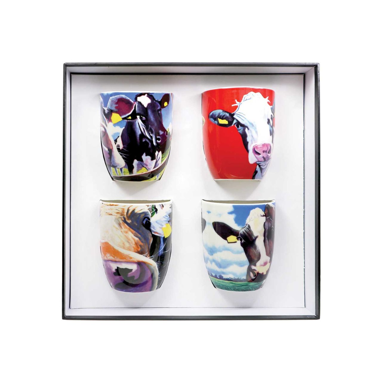 Set of Four Mugs with six different images of the iconic Eoin O'Connor Cow designs. Set of Four 12 Oz Mugs made of New Bone China. With curved handle to ensure you do not scald your fingers and presented in a gift box.