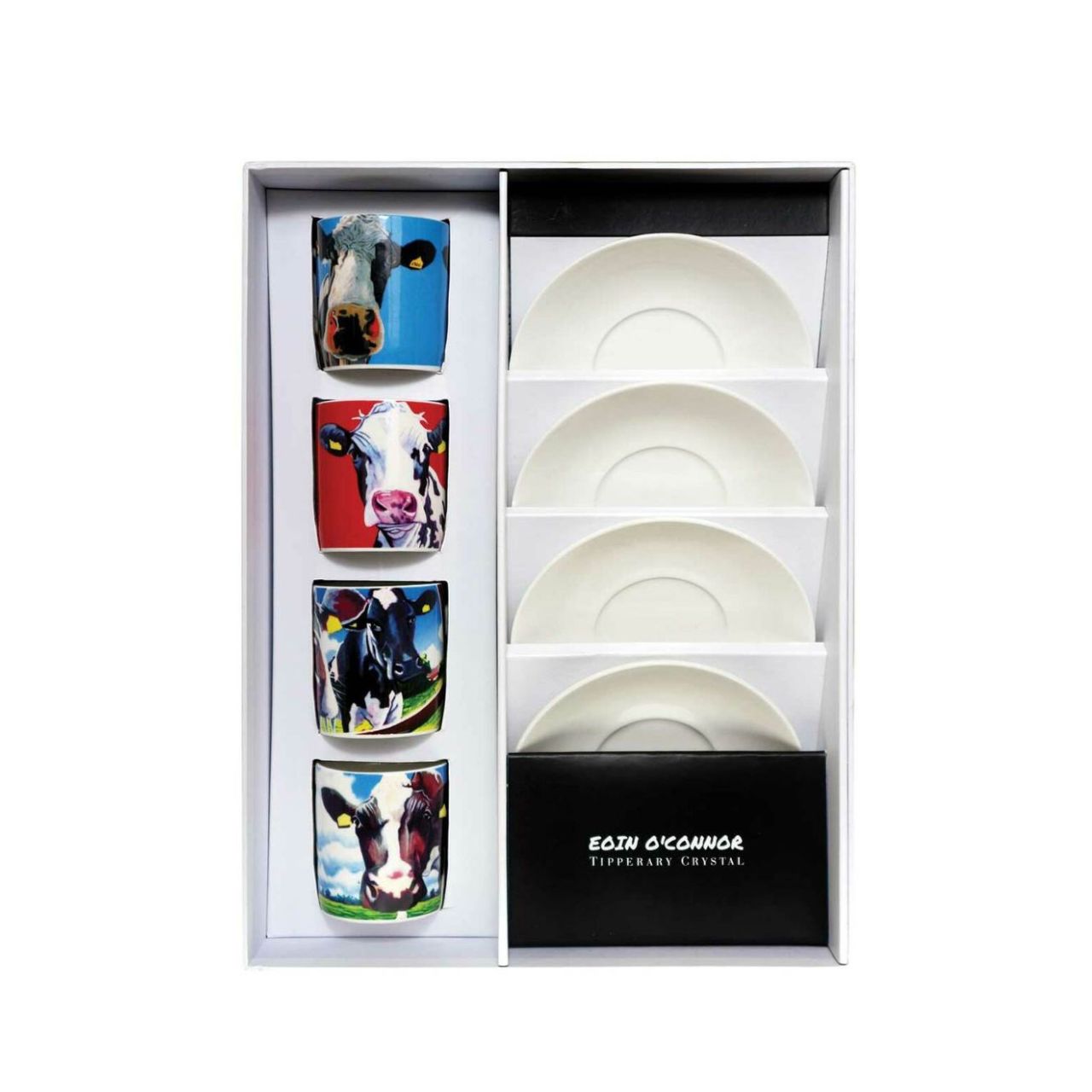 A fun set of four Egg Cup holders with Matching Spoons that have the Iconic Cow design from Eoin O'connor. Set of four New Bone China Egg Cups and four tea spoons in a gift box with cow print.