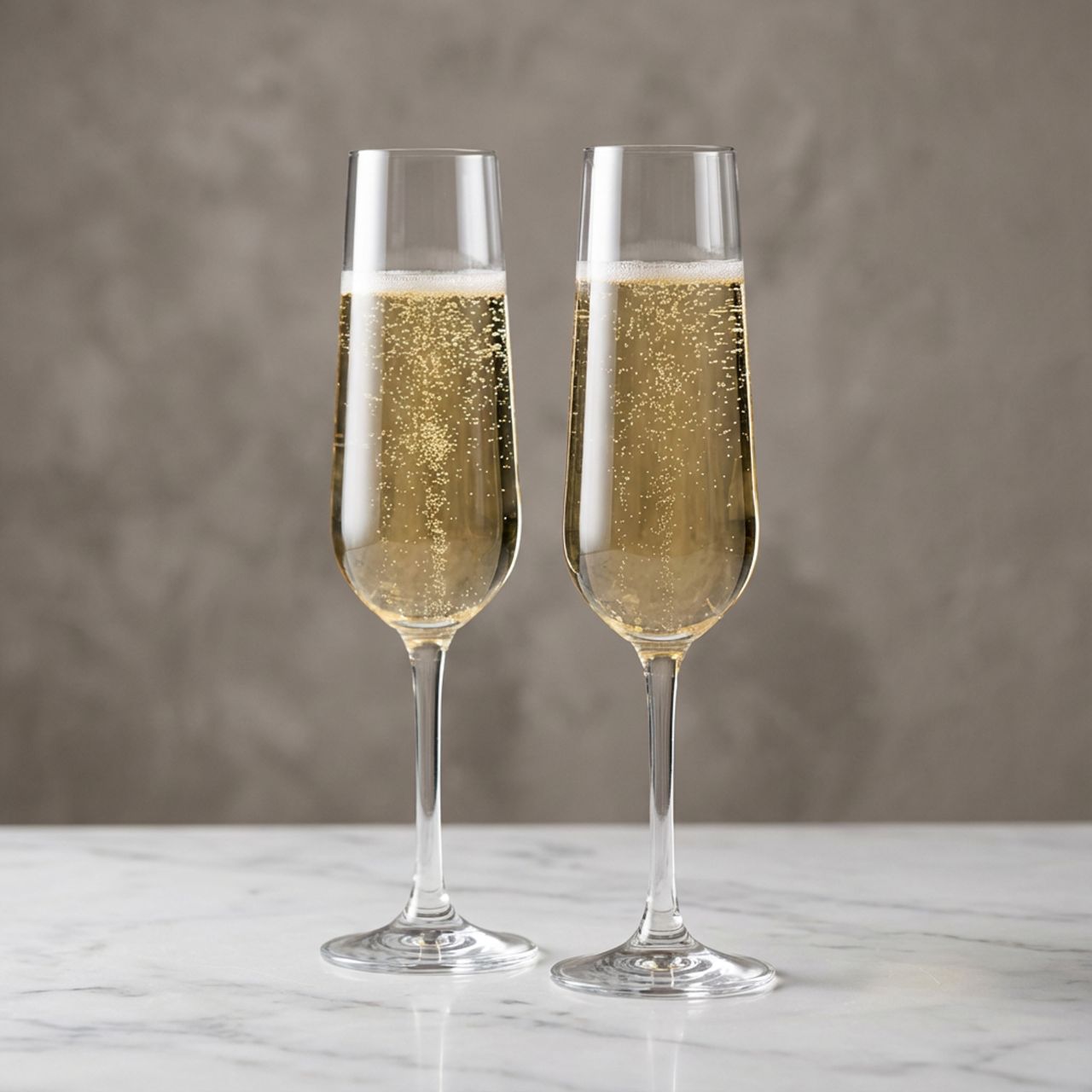 Celebrate life's finest moments with this elegant pair of crystal champagne glasses from Tipperary. Crafted with precision and refinement, the Eternity collection features timeless design that complements any table setting.