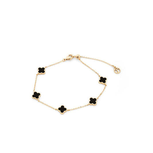 Elevate your everyday elegance with this stunning Black Onyx Fleur Bracelet from Tipperary's celebrated collection. Crafted in lustrous gold, the delicate fleur design captures timeless sophistication while the rich black onyx stone adds depth and intrigue to your wrist.