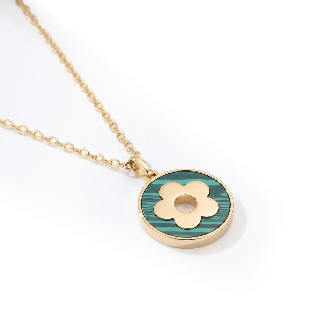 Elevate your everyday elegance with this stunning green malachite disc pendant from Tipperary's Fleur Collection.