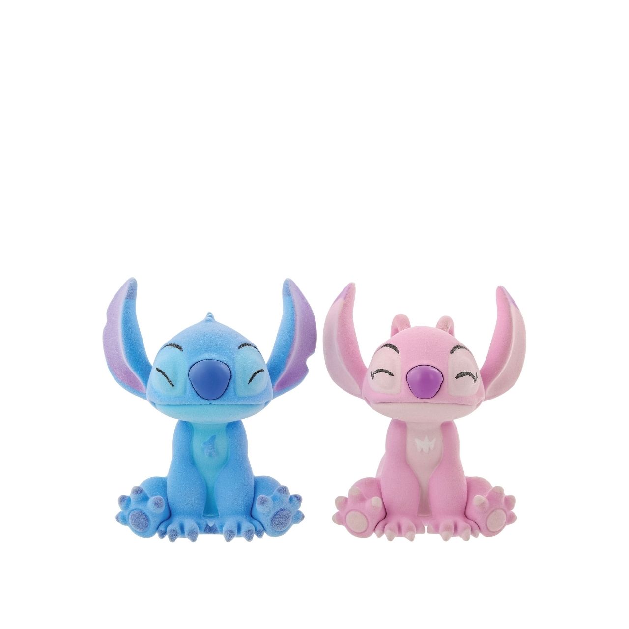 This dynamic duo are together again in this super cute flocked figurine pair. With magnets in their noses to pull them together, they look like they are having a sweet eskimo kiss.