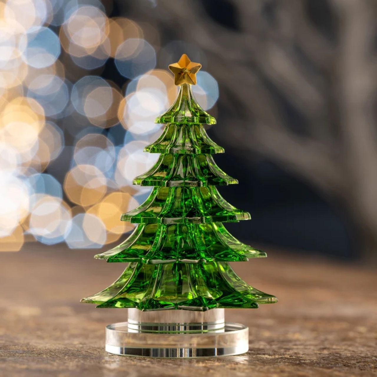 Add festive elegance to your holiday décor with this delicate and sparkling crystal Christmas tree. Its intricate design makes it an ideal seasonal accent piece.