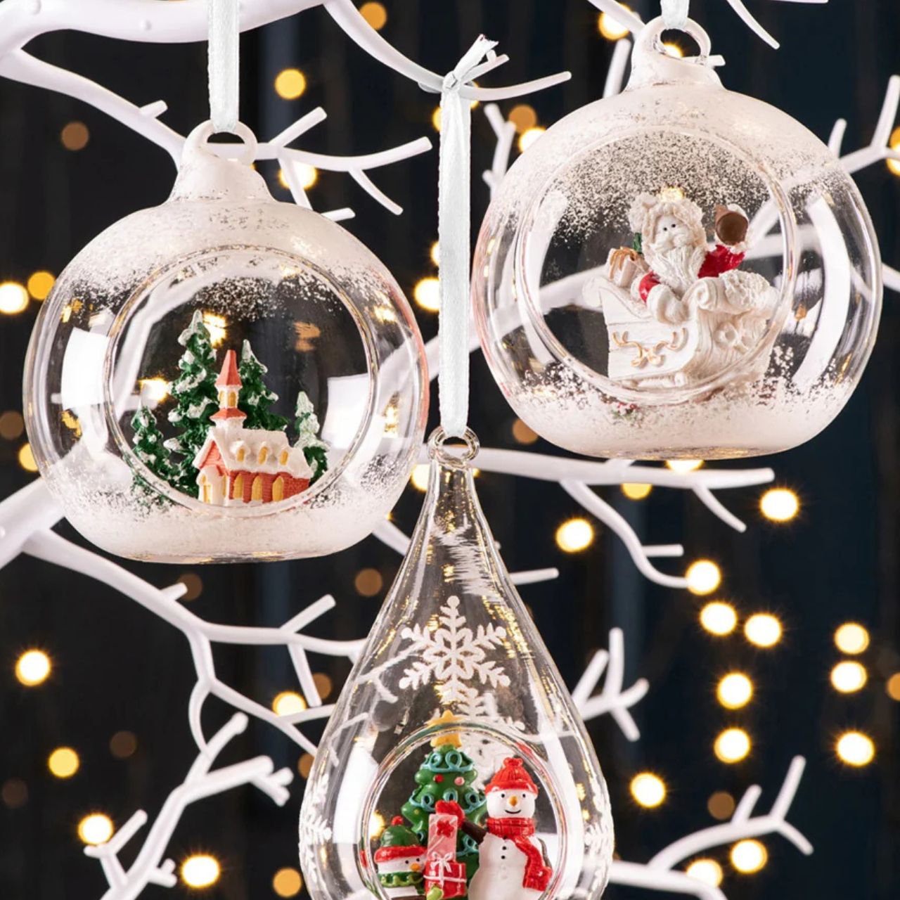 Take a peek into this magical Hanging Bauble. Featuring a jolly Santa in his Sleigh ready to deliver lots of Christmas presents. Ready to hang this ornament is sure to stand out on your tree. Display with other baubles from this range.