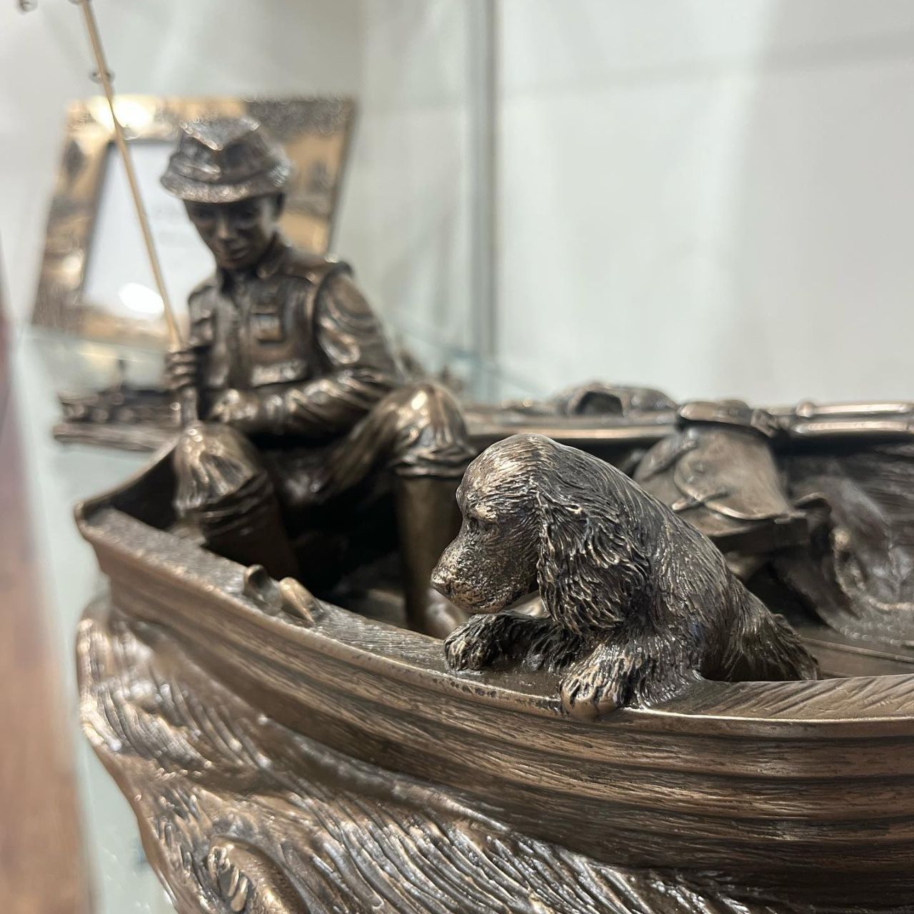 A Day's Fishing by Genesis  This stunning piece of a man fishing from a boat made by Genesis could be a great gift for a fishing enthusiast or as a presentation piece.