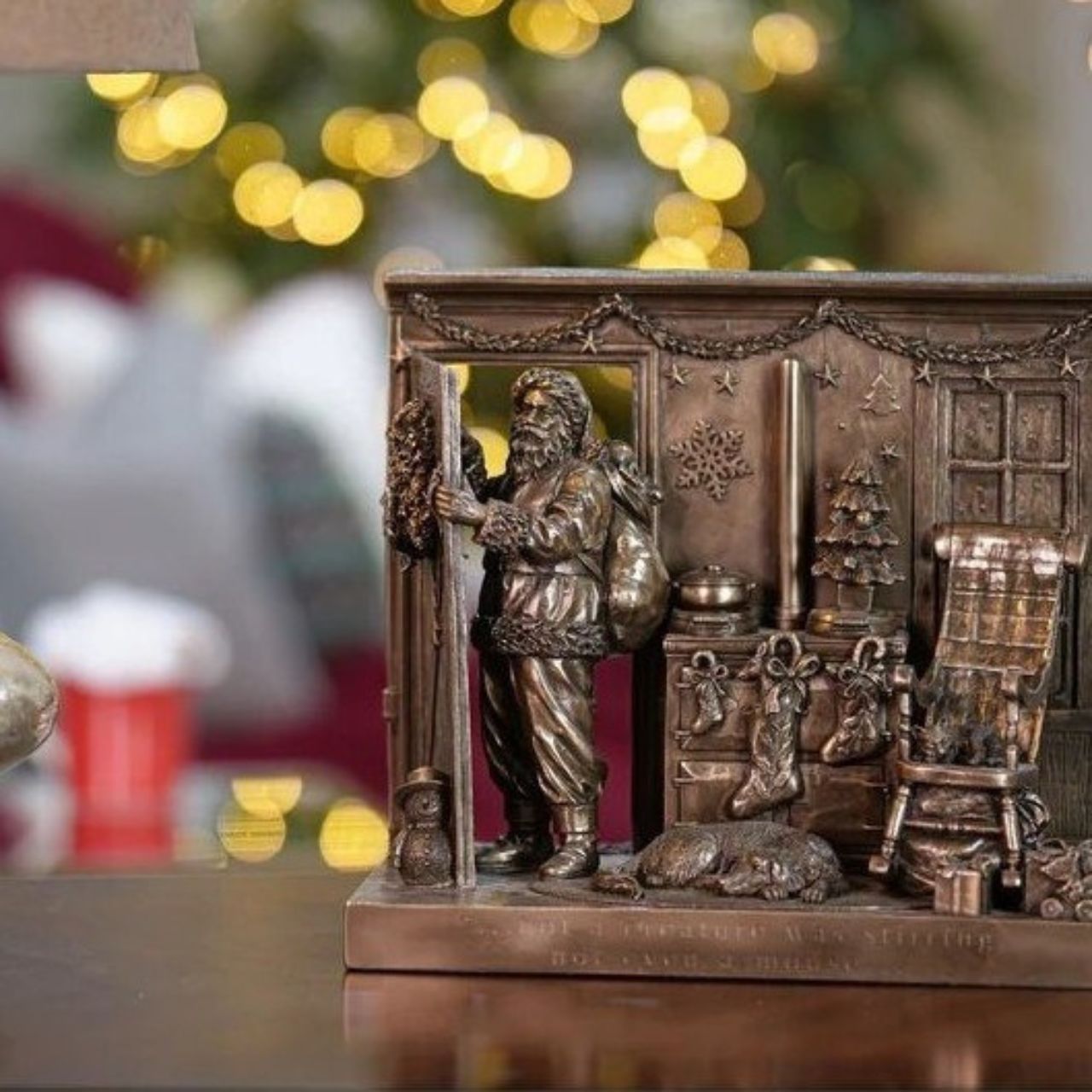 Beautifully crafted in cold cast bronze, this Christmas scene incorporates Father Christmas and his bag of toys leaving the scene after filling the stockings for Christmas. The words 'Not a creature was stirring not even a mouse' crafted into the front of the scene this Christmas display would make a wonderful gift.