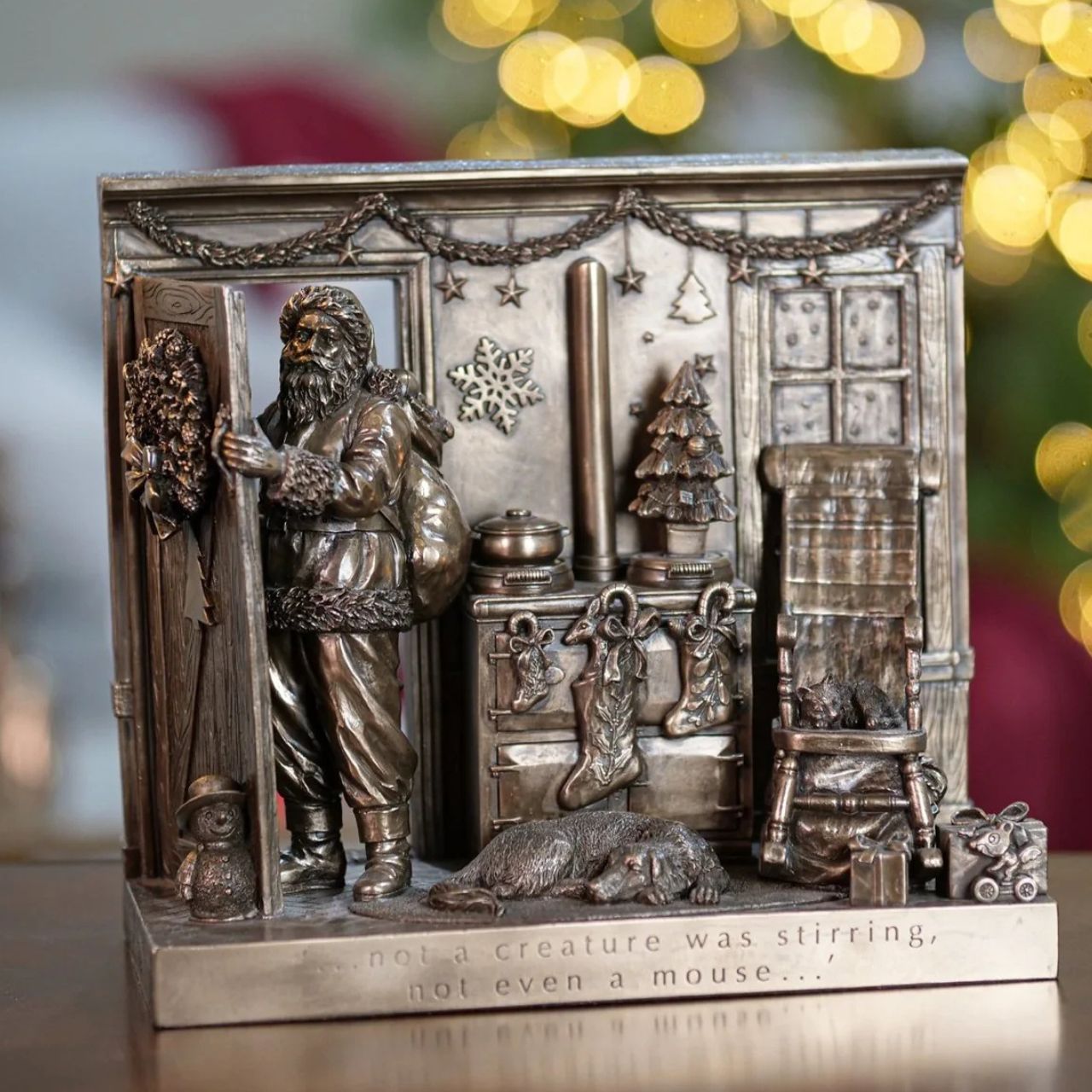Beautifully crafted in cold cast bronze, this Christmas scene incorporates Father Christmas and his bag of toys leaving the scene after filling the stockings for Christmas. The words 'Not a creature was stirring not even a mouse' crafted into the front of the scene this Christmas display would make a wonderful gift.