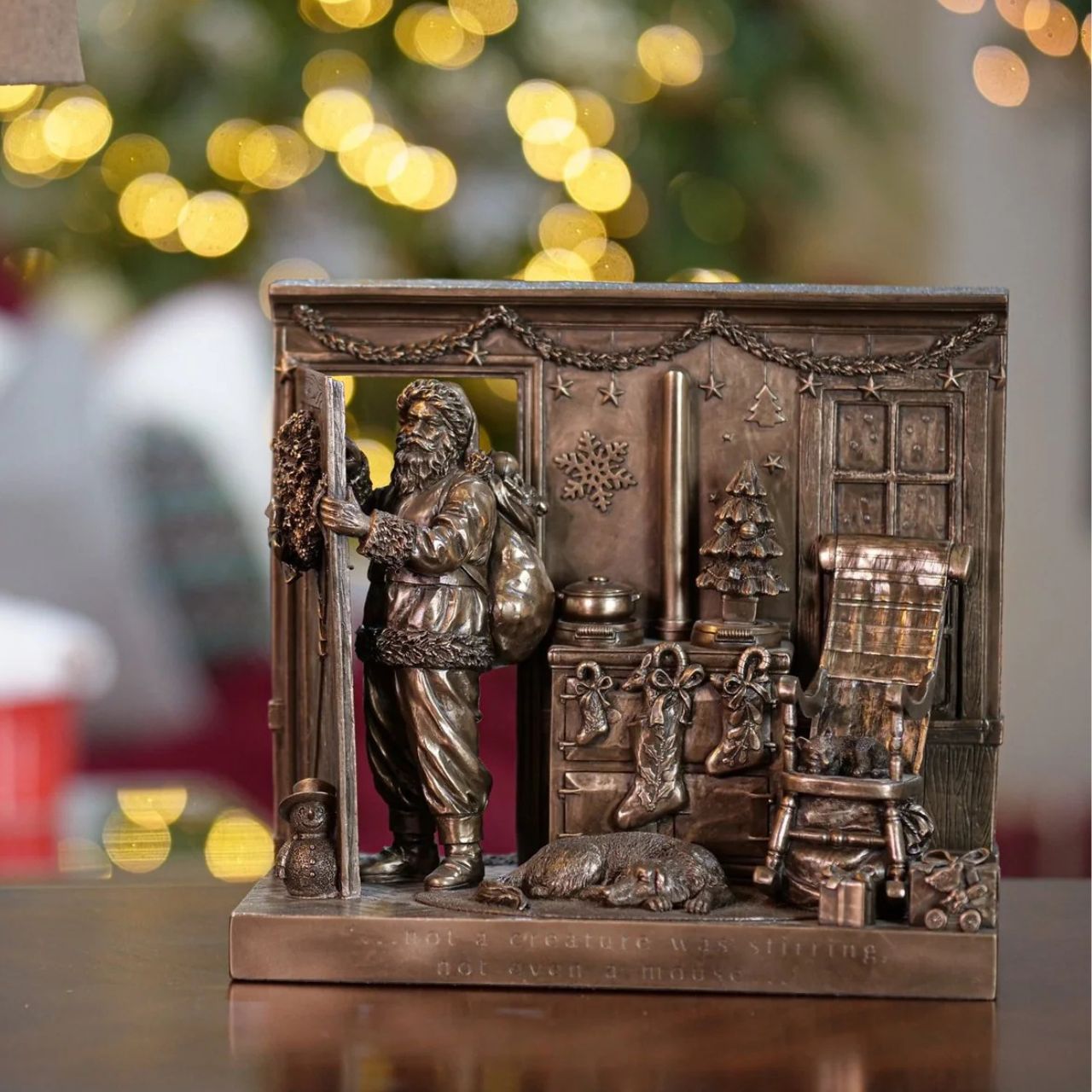 Beautifully crafted in cold cast bronze, this Christmas scene incorporates Father Christmas and his bag of toys leaving the scene after filling the stockings for Christmas. The words 'Not a creature was stirring not even a mouse' crafted into the front of the scene this Christmas display would make a wonderful gift.