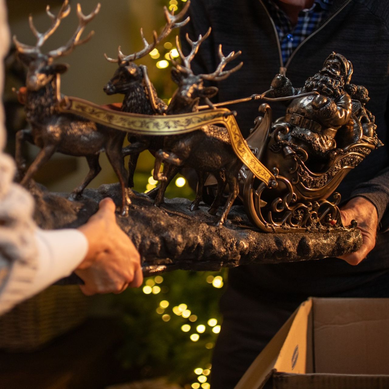 Santa on Sleigh by Genesis  Beautifully crafted from cast bronze and handcrafted, this Santa on Sleigh sculpture will make a beautiful addition to your home during the holidays. Intricately detailed, this Santa Claus features three reindeer's pulling his sleigh.