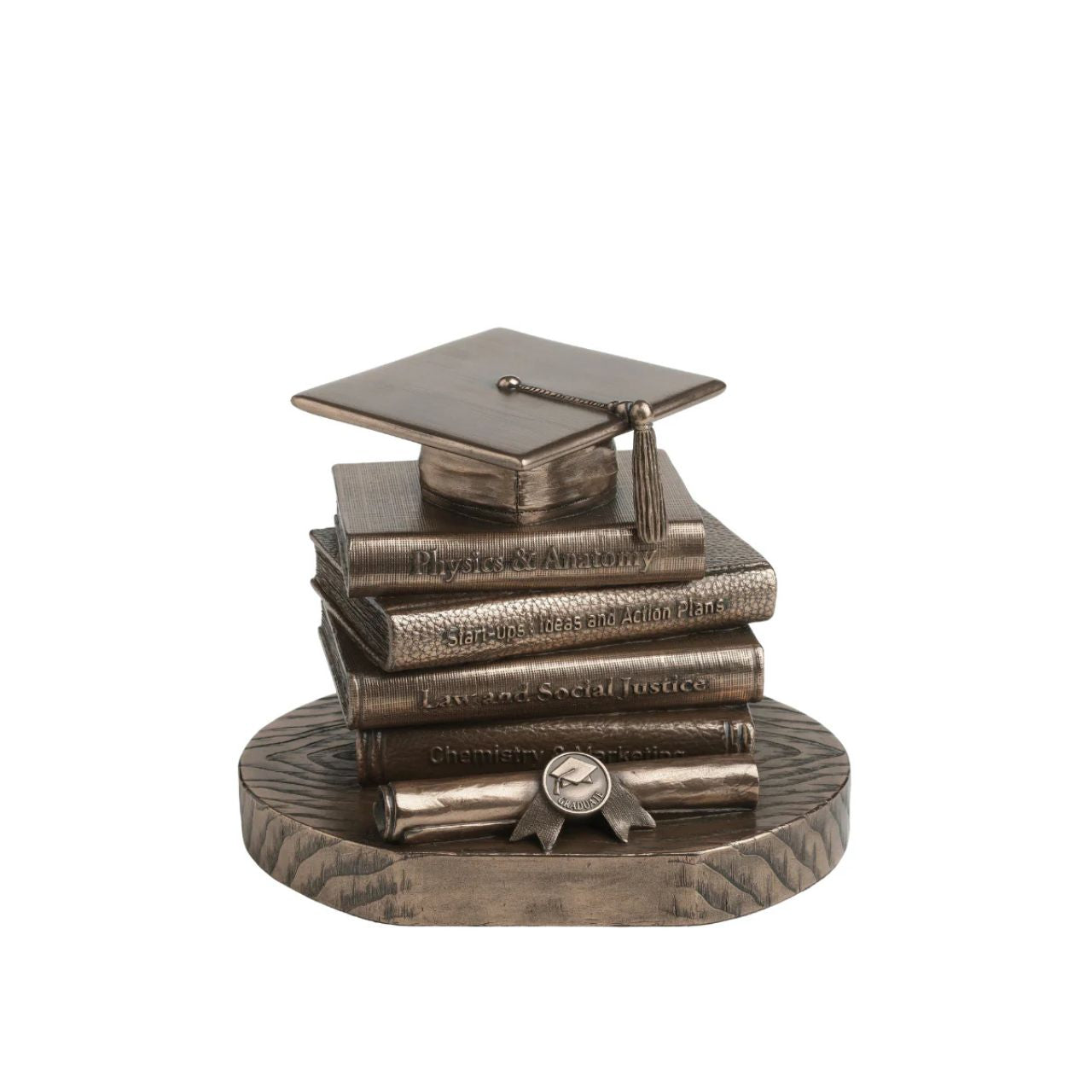 Celebrate academic achievement with this timeless Graduation Cap &amp; Books Sculpture. The piece showcases a stacked arrangement of textbooks each titled with inspirational subjects like Physics & Anatomy, Law and Social Justice, and Start-ups & Action Plans.