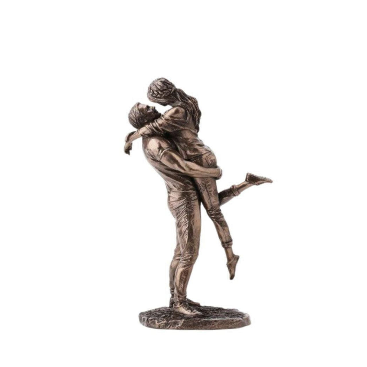 A beautiful bronze coloured statue of a couple in a loving embrace.