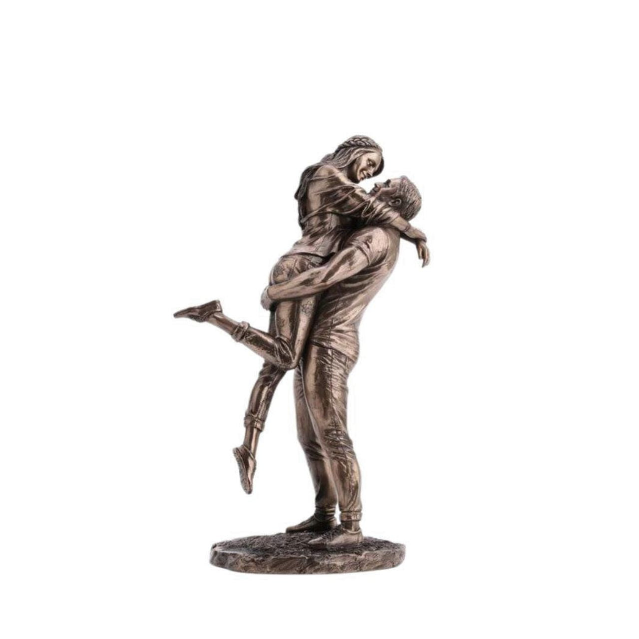 A beautiful bronze coloured statue of a couple in a loving embrace.