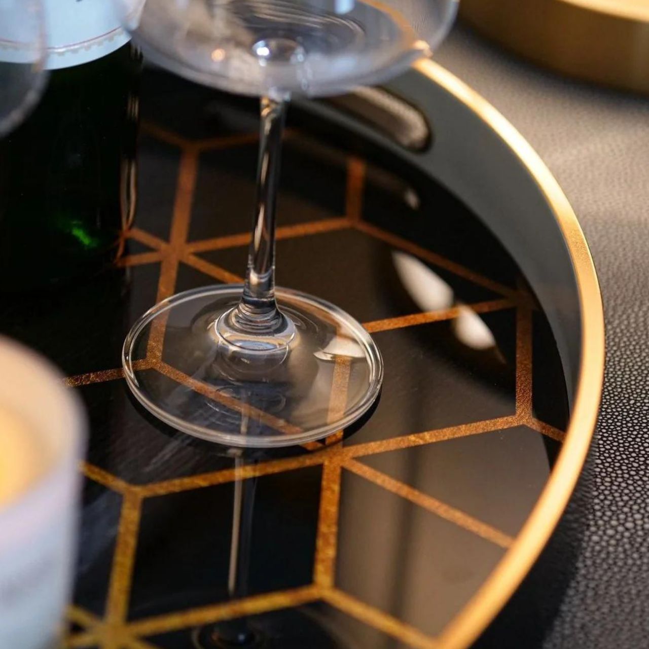 Mindy Brownes Geometric Trays Set of 2  A stunning set of two oval trays in midnight blue, with a gold rim and modern geometric prints.