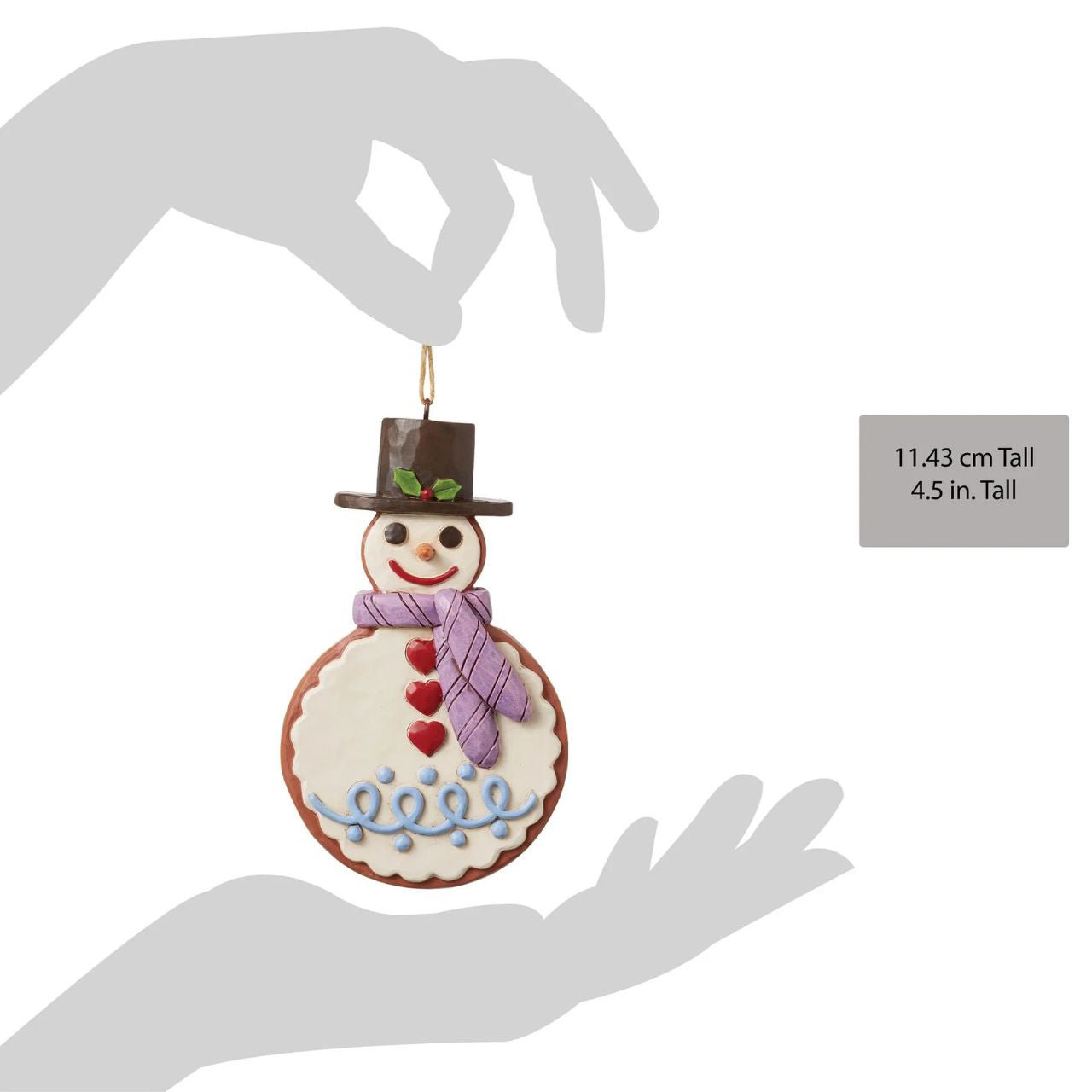 This Christmas ornament is modelled to look like a gingerbread cookie! This eye-catching snowman is patterned with rosemaling icing, candy pieces, and sprinkles. Will make a sugary sweet addition to your family's holiday tree collection.