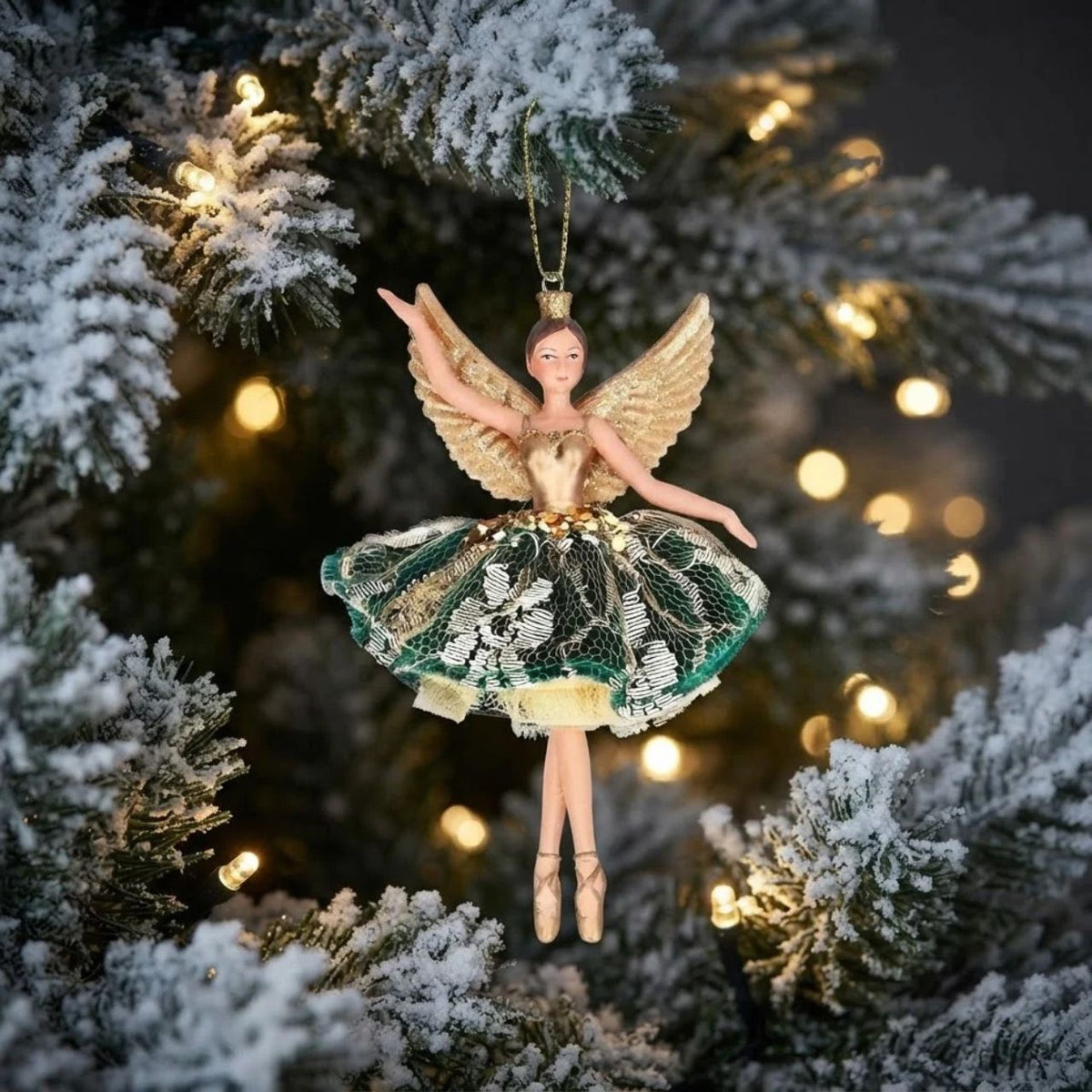 Elevate your holiday décor with the Gisela Graham Christmas Green and Gold Lace Fairy. Crafted with delicate and exquisite detailing, this fairy adds a refined, whimsical touch to any festive setting, perfect for those seeking a graceful and stylish ornament to enrich their Christmas ambiance.