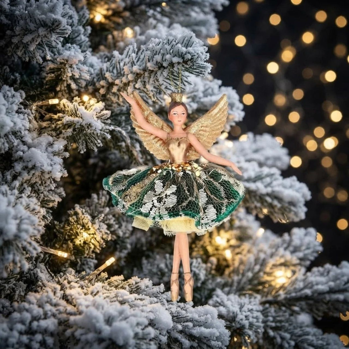 Elevate your holiday décor with the Gisela Graham Christmas Green and Gold Lace Fairy. Crafted with delicate and exquisite detailing, this fairy adds a refined, whimsical touch to any festive setting, perfect for those seeking a graceful and stylish ornament to enrich their Christmas ambiance.