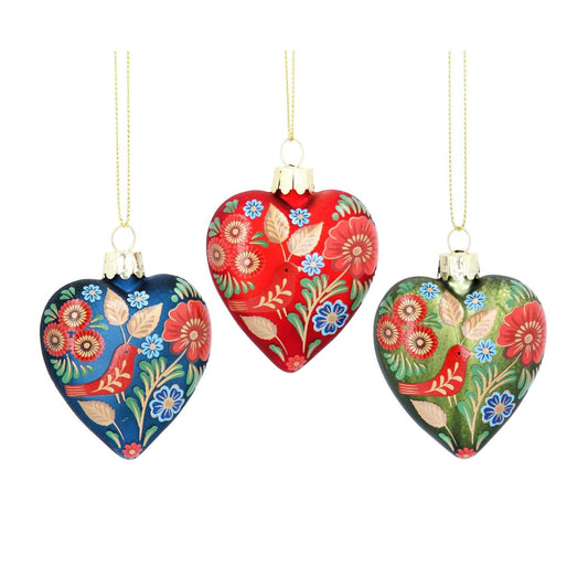 Folk Art Glass Heart Christmas Hanging Ornament by Gisela Graham  This Gisela Graham Folk Art Glass Heart Christmas Hanging Ornament will bring a lovely touch to your holiday décor. Made with high-quality glass, this ornament is sure to make a lasting impression. Perfect for adding a unique personal touch to your holiday decorations.