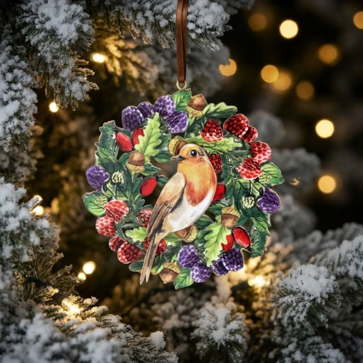 Celebrate the festive season with the Gisela Graham Robin & Berries Disc Christmas Hanging Decoration. Crafted from natural wood, this elegant ornament features a charming robin surrounded by vibrant red berries, bringing a timeless and refined touch to your holiday décor.
