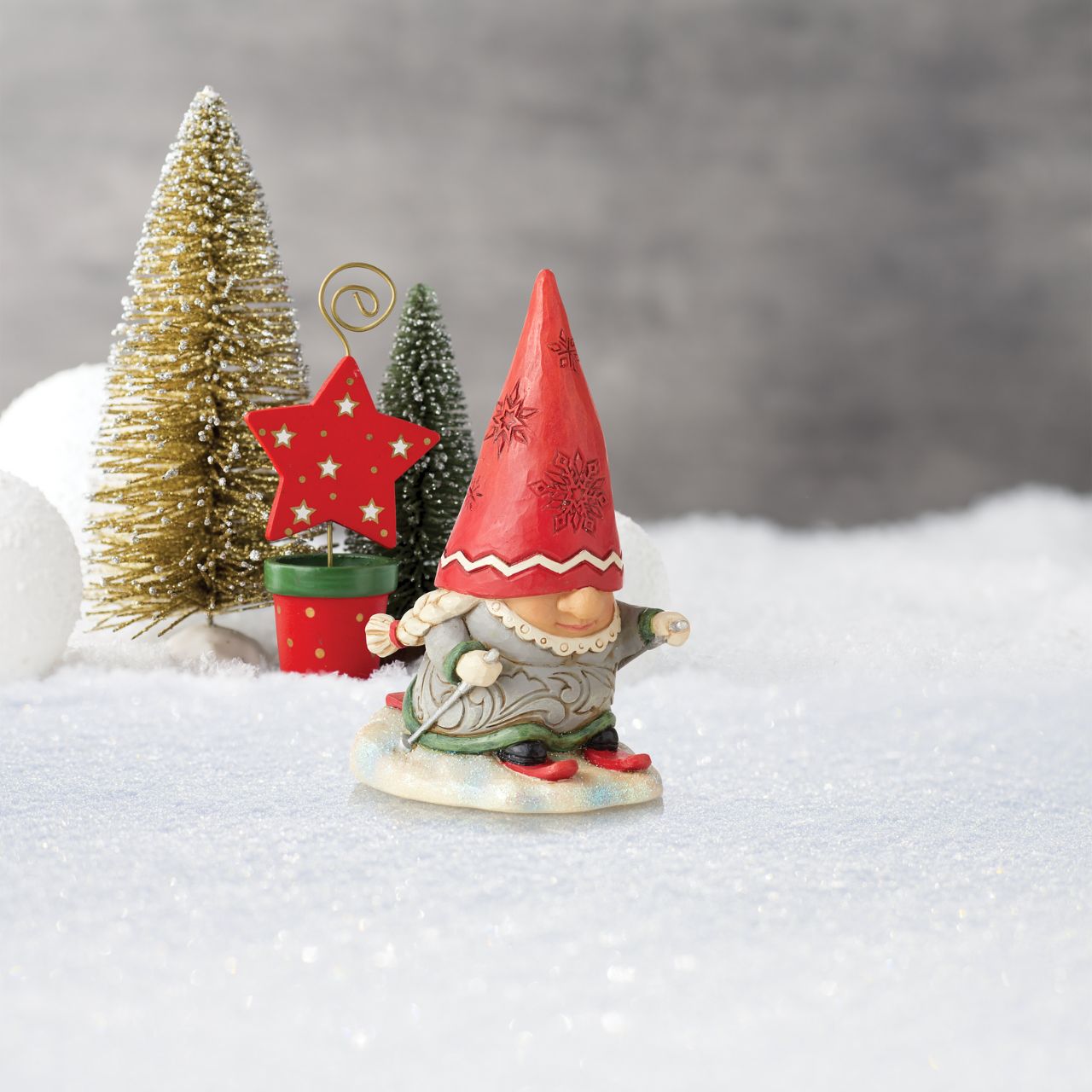 Gnome Skier with Braids Figurine by Jim Shore  "Gnomebody loves Christmas as much as Jim Shore" Gnomes have fast become a collectors favourite for Jim Shore and this collection, new to collection, it won't disappoint. This Snow loving couple are ready for the slopes.