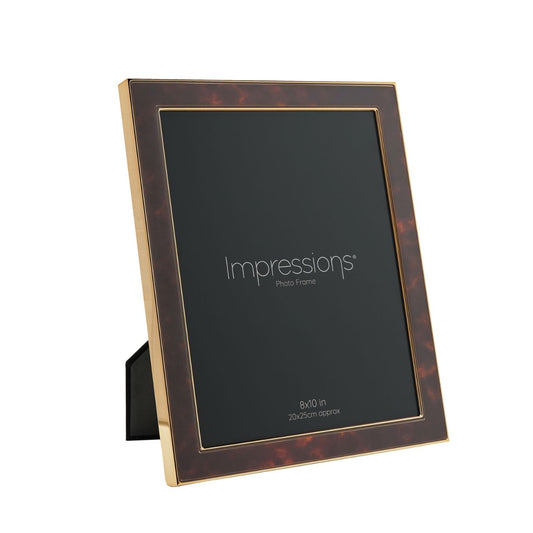 The Impressions Gold Tone Photo Frame 8" x 10" offers a stunning showcase for photographs or artwork.