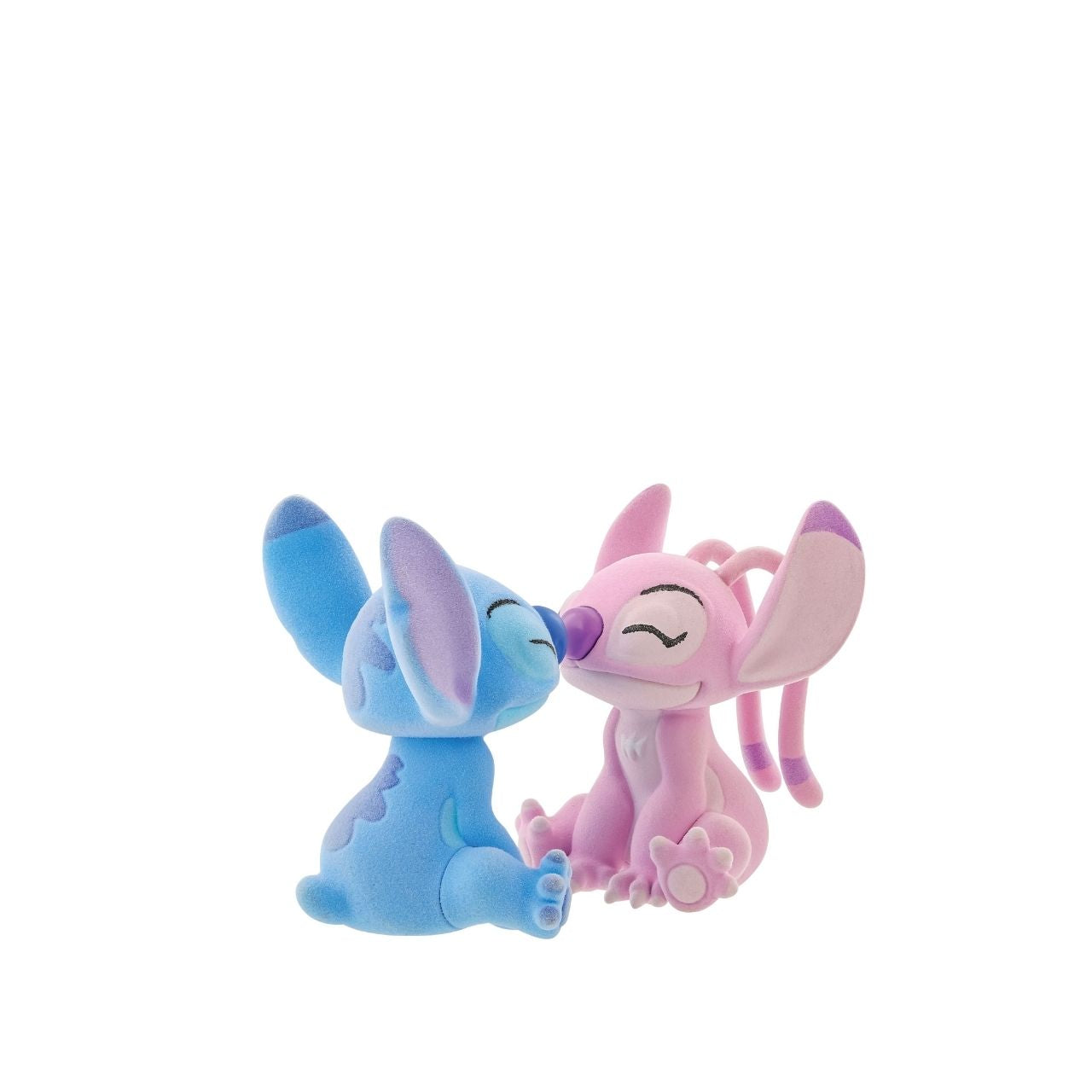 This dynamic duo are together again in this super cute flocked figurine pair. With magnets in their noses to pull them together, they look like they are having a sweet eskimo kiss.