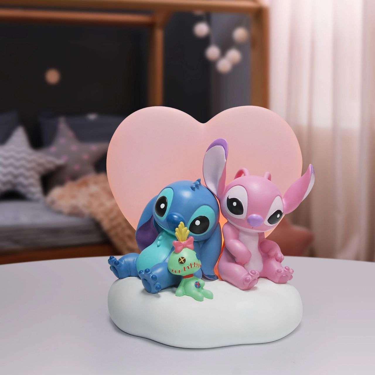 Featuring, Stitch, Angel and Scrump, this cute and cosy scene features a light up pink heart that softly glows. This piece is perfect for any Disney or Stitch fans or in a nursery or bedroom setting.