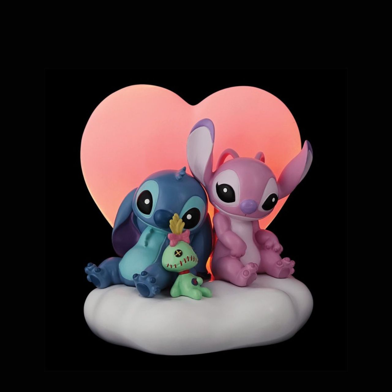 Featuring, Stitch, Angel and Scrump, this cute and cosy scene features a light up pink heart that softly glows. This piece is perfect for any Disney or Stitch fans or in a nursery or bedroom setting.
