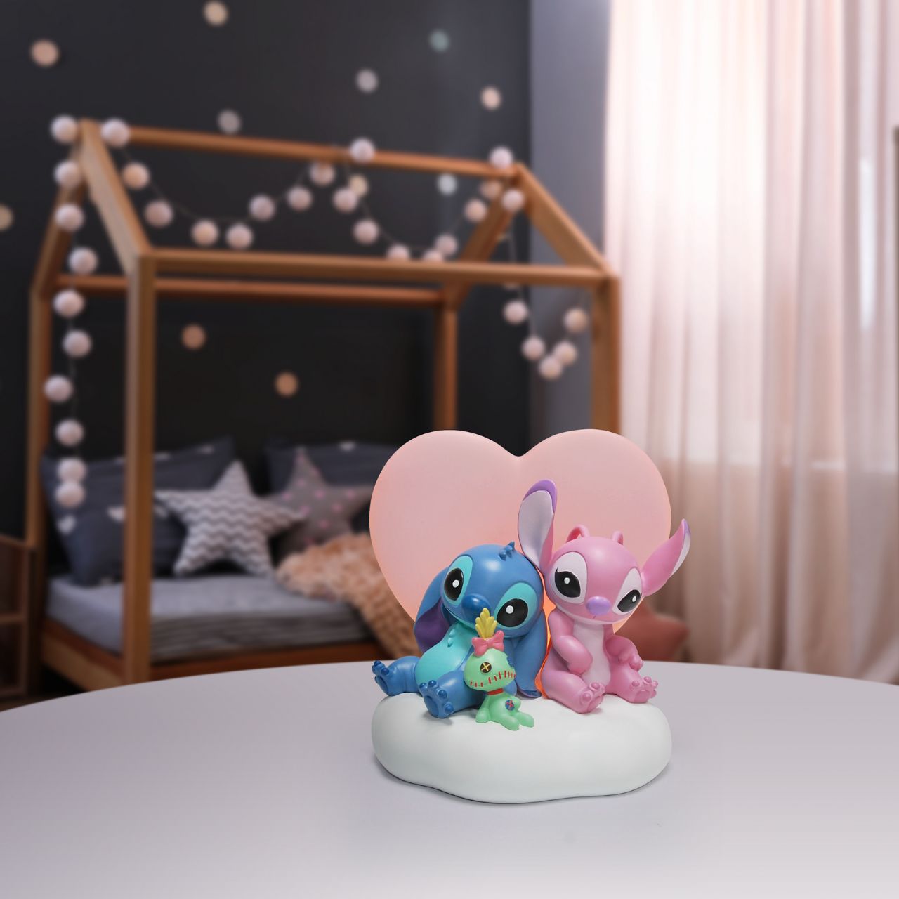 Featuring, Stitch, Angel and Scrump, this cute and cosy scene features a light up pink heart that softly glows. This piece is perfect for any Disney or Stitch fans or in a nursery or bedroom setting.