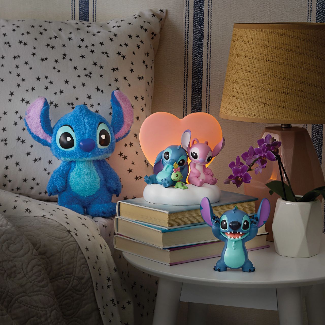 Featuring, Stitch, Angel and Scrump, this cute and cosy scene features a light up pink heart that softly glows. This piece is perfect for any Disney or Stitch fans or in a nursery or bedroom setting.