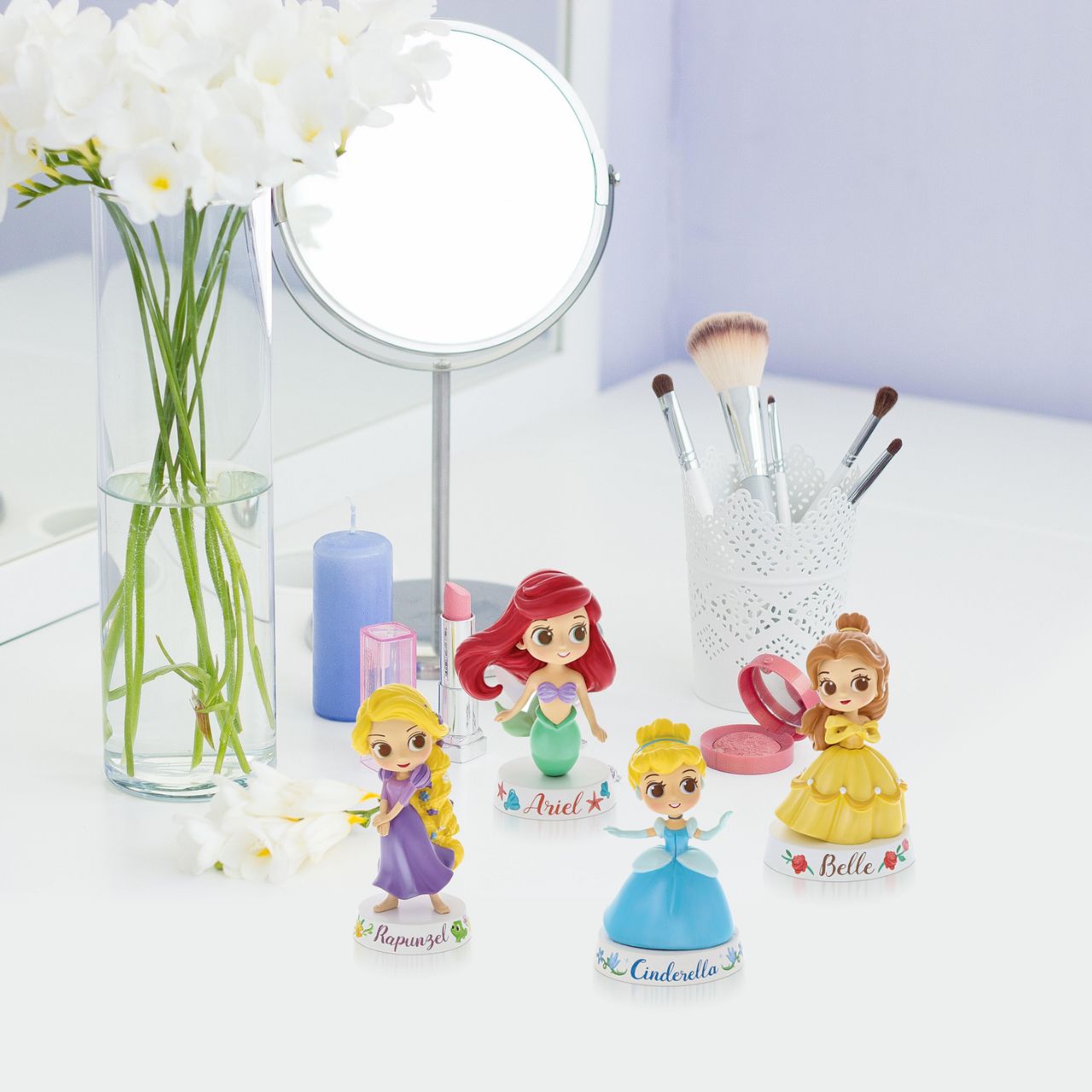 This mini Ariel figurine is the perfect gift or addition to any Disney collection. Based on the animated Little Mermaid film, this piece features Ariel's flowing red hair and green mermaid tail. A great little collectible. Made from high quality vinyl.