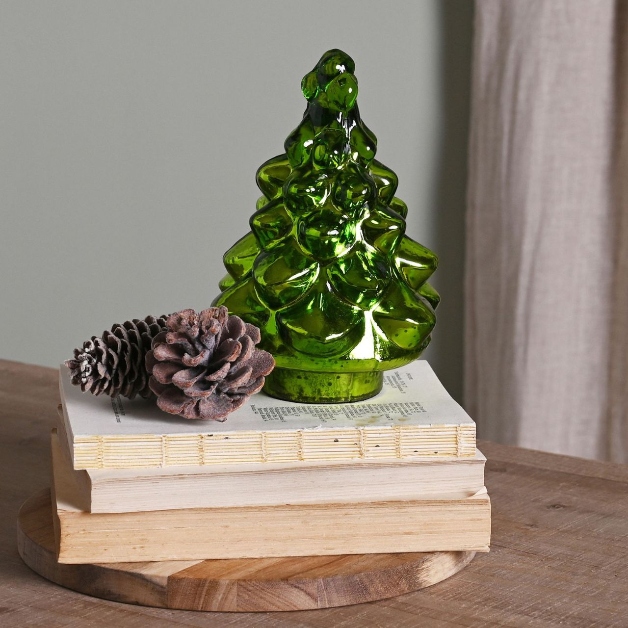Green Recycled Glass Tree  A recycled glass green Christmas tree ornament from THE SEASONAL GIFT CO.  This affectionately designed ornament makes a delightful addition to homes during the festive period.