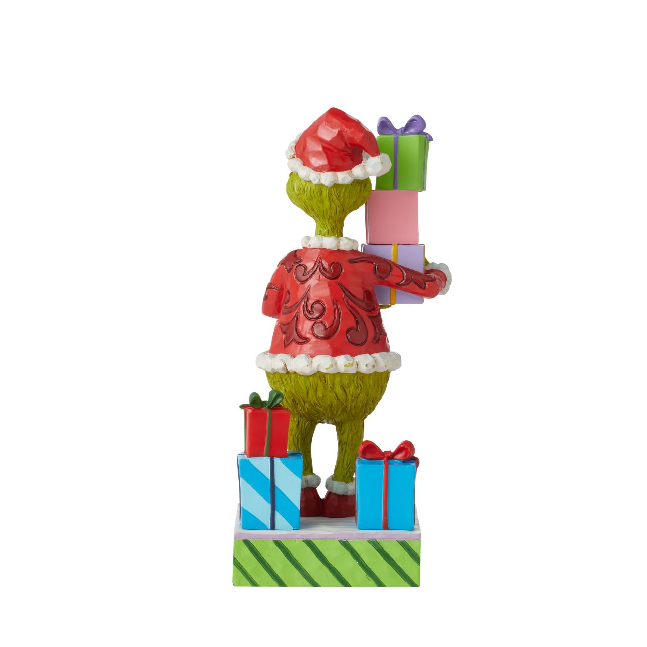 Grinch Holding Presents Figurine  Is the Grinch stealing presents again or has his heart changed to a kinder shape? You decide The Grinch's intentions when placing this colourful Jim Shore design in your home. Whatever his motive, The Grinch is giddy to be apart of your holiday.