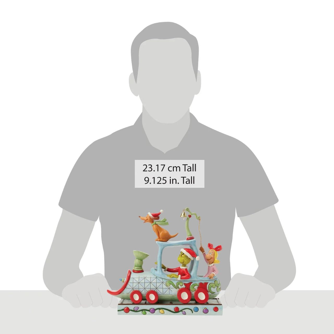 All aboard the Grinchy Express. In this charming Jim Shore creation, The Grinch steers a train engine adorned with delightful floral rosemaling. Max rides on top while Cindy Lou rings a real bell, bringing Seuss's classic tale to life with sound.