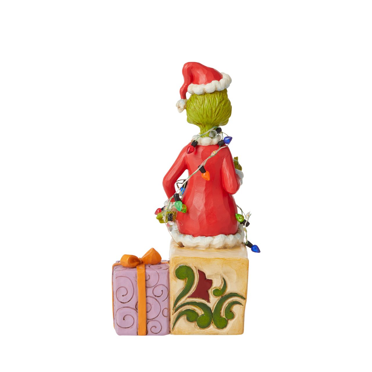 Grinch with lights Figurine - The Grinch  With a grimace on his green grouchy face, the Grinch, by Jim Shore, finds himself wrapped in a glowing string of lights as he tries to ruin the holiday. Sitting on a present, the Grinch gathers himself before he continues stealing Whoville gifts.