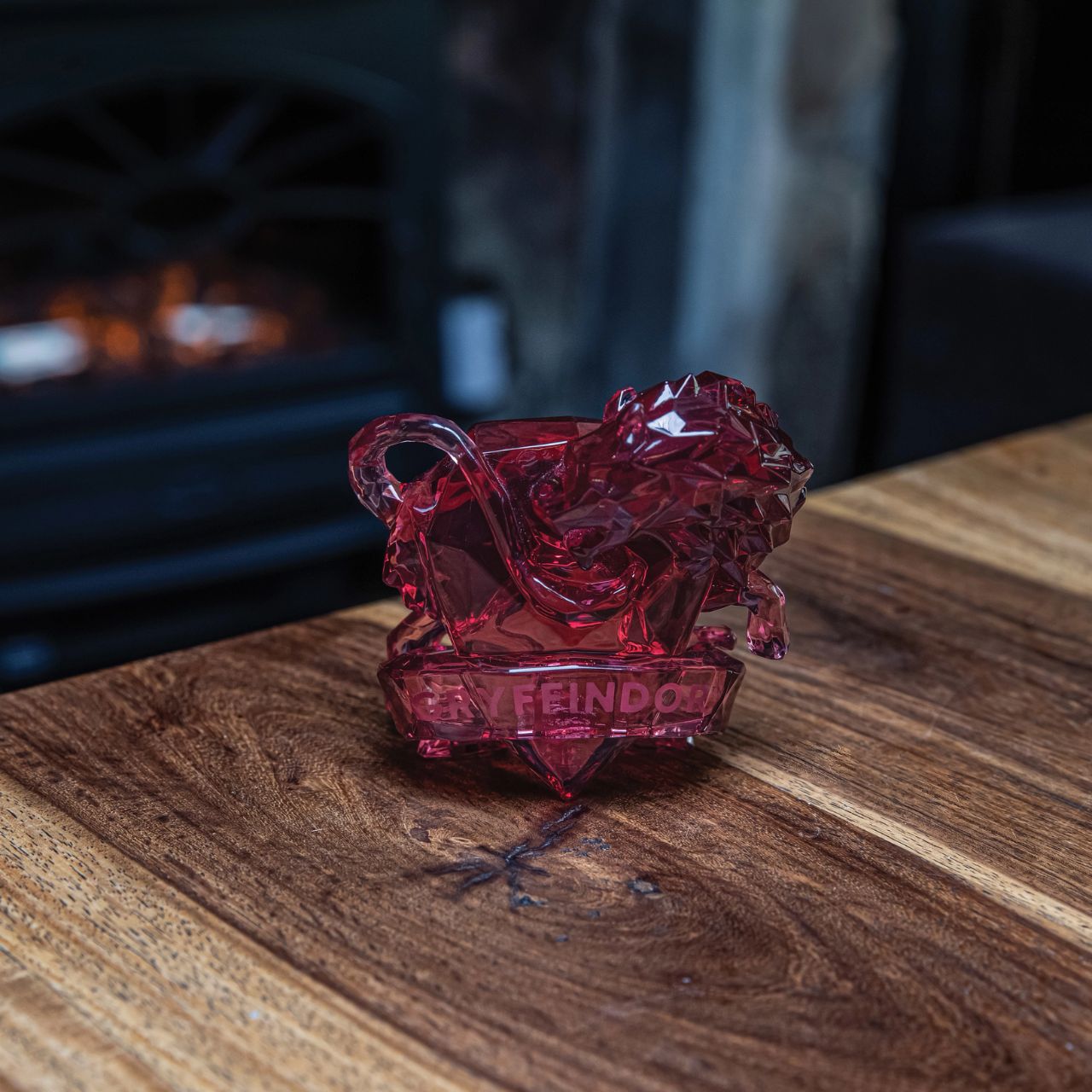 This "gem-cut" acrylic sculpture reflects the iconic Gryffindor House Logo.