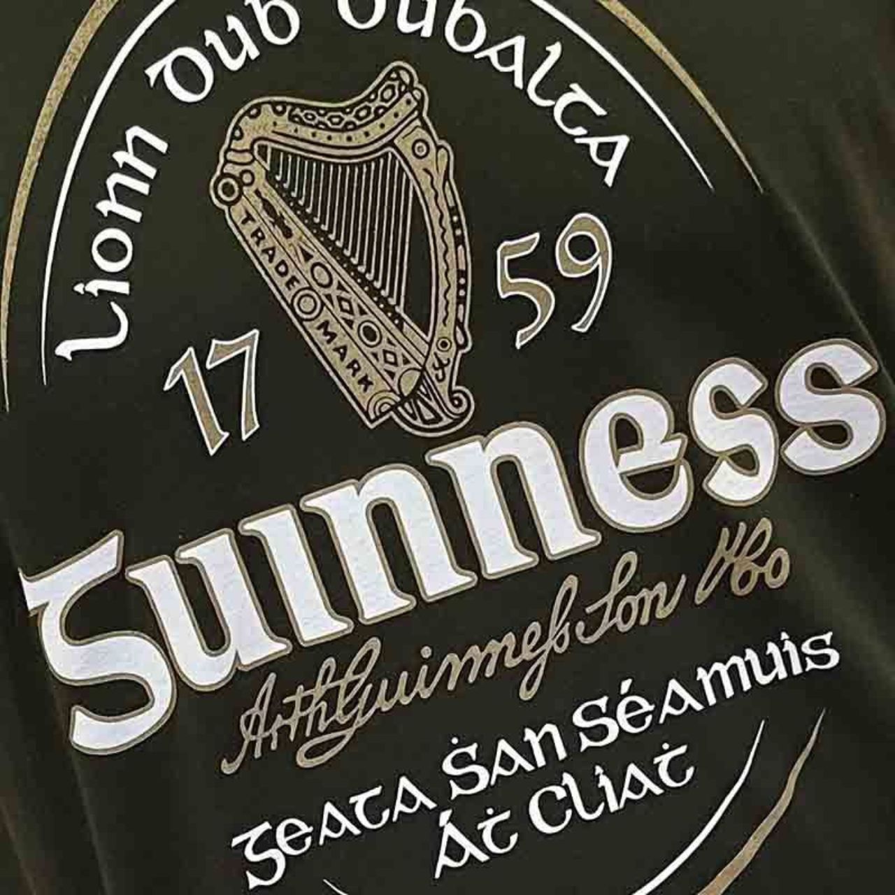 This Bottle Green Guinness Irish Label T-Shirt is a component of the official Guinness Merchandise Collection. It showcases the iconic vintage Guinness Label from Ireland.